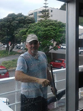 Window Cleaner using a squeegee